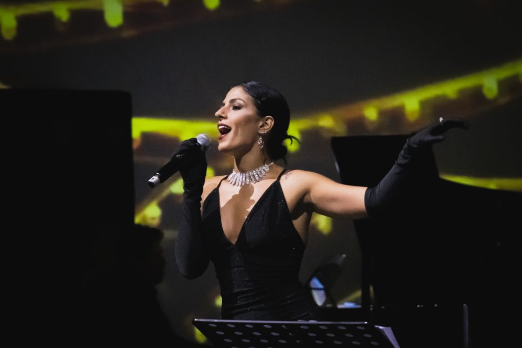 Amanda Maalouf singing on stage