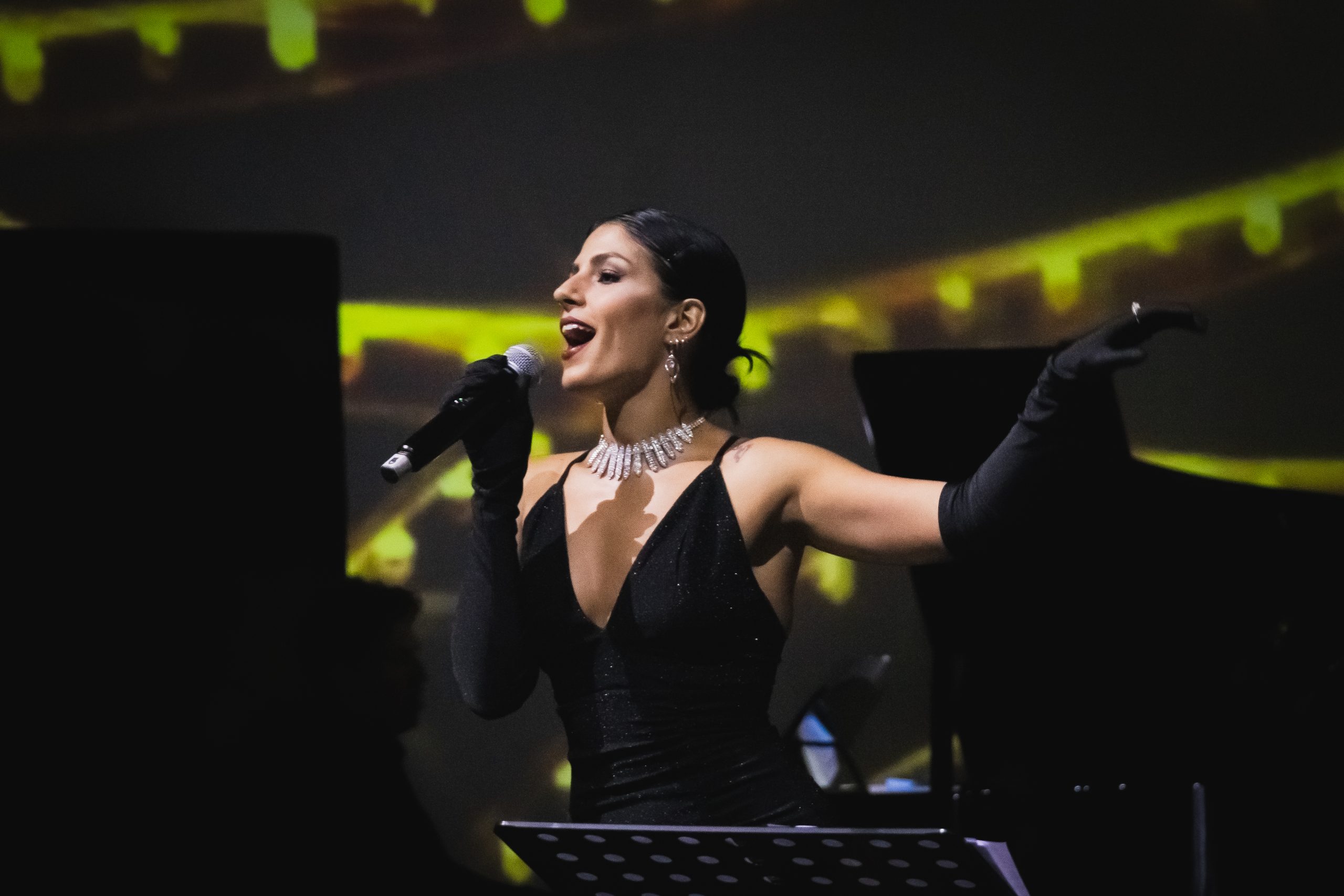 Amanda Maalouf singing on stage